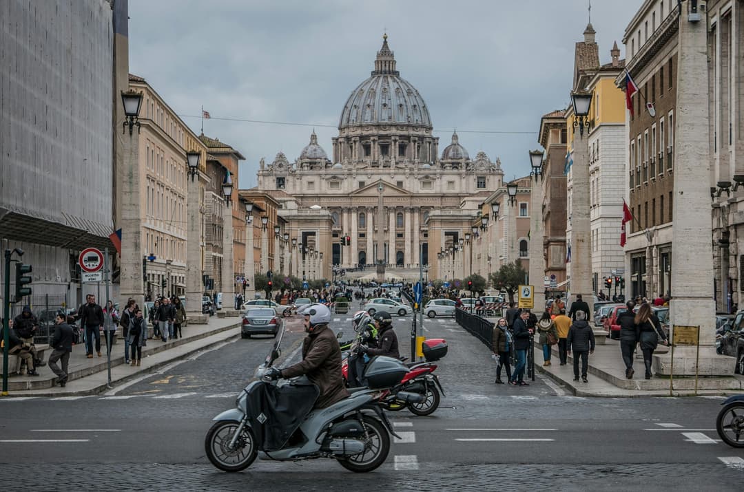 Prowall Free Wallpaper | St. Peter's Basilica view with vibrant street life, Rome.
