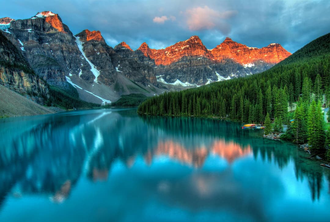 Prowall Free Wallpaper | Capture the serene beauty of Moraine Lake with sunrise reflections in Banff National Park.
